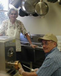 Kitchen staff working at the noodle making machine